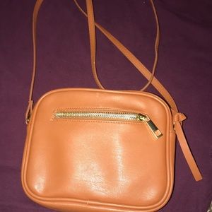 Tan  Cross body purse , with gold details